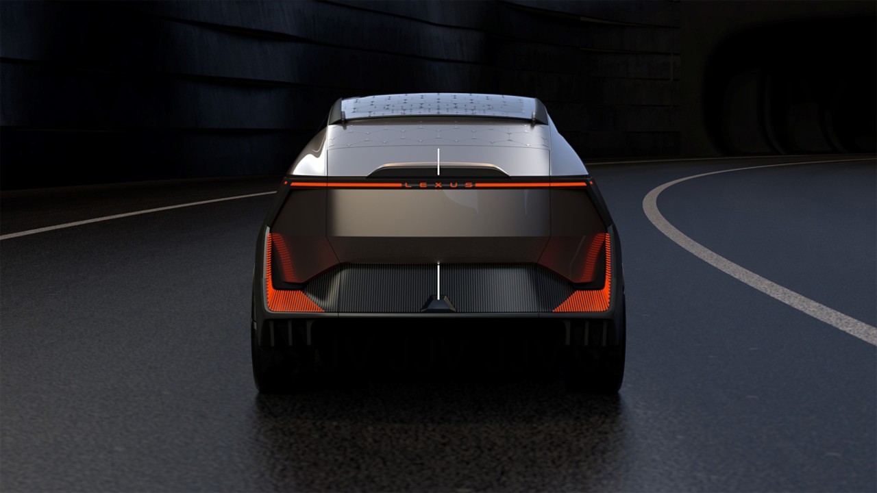 A rear view of the Lexus LF-ZL Concept car driving on a road